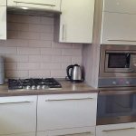 Какие расстояния должны быть между холодильником и стенкой