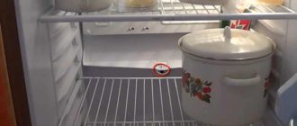 Why does water accumulate under the vegetable drawer in the refrigerator?