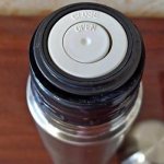 Spring loaded valve for liquid outlet