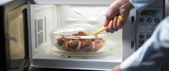 Glass container with food in the microwave